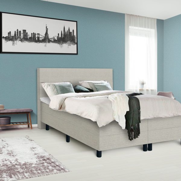 Dark poster on the wall with copy space in bright bedroom interior with bench, grey chair and patterned carpet