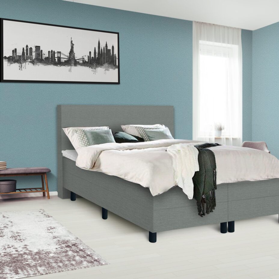 Dark poster on the wall with copy space in bright bedroom interior with bench, grey chair and patterned carpet