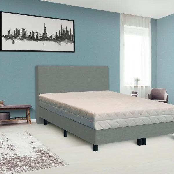 Dark poster on the wall with copy space in bright bedroom interior with bench, grey chair and patterned carpet