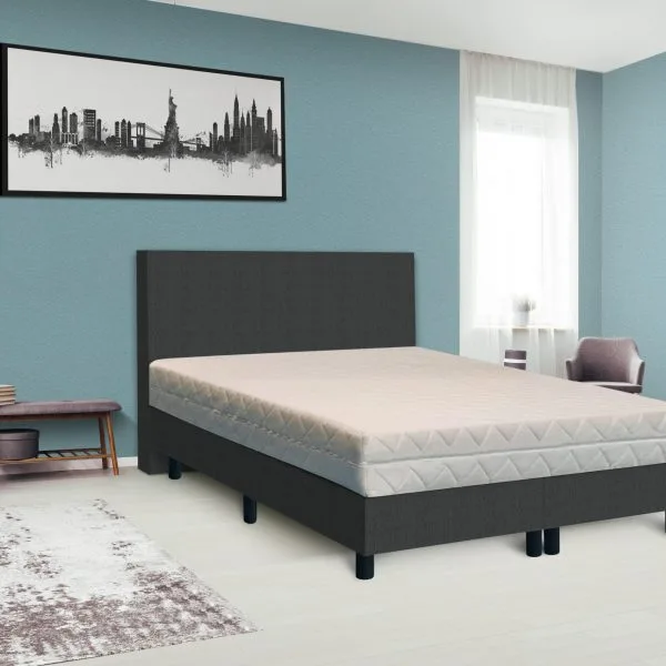 Dark poster on the wall with copy space in bright bedroom interior with bench, grey chair and patterned carpet